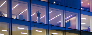 Exterior view of office building lit at night