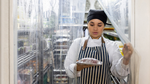 Chef leaving cooler through strip curtains