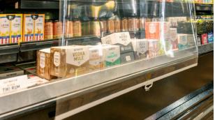 Photo of night covers over refrigerated goods at grocery store