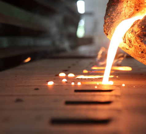 Cuple smiling while drying the dishes and a smart thermostat in the background