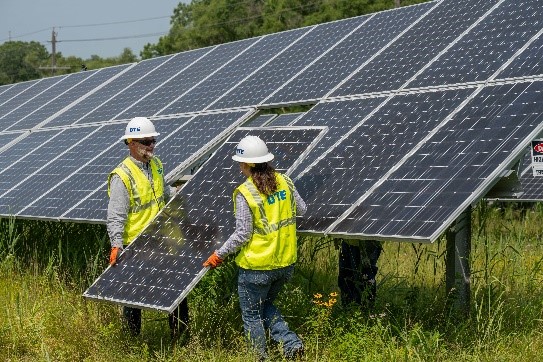 DTE employees installing wind panels in wind park