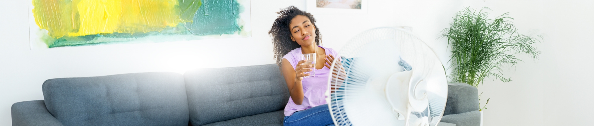 Woman cooling in front fan